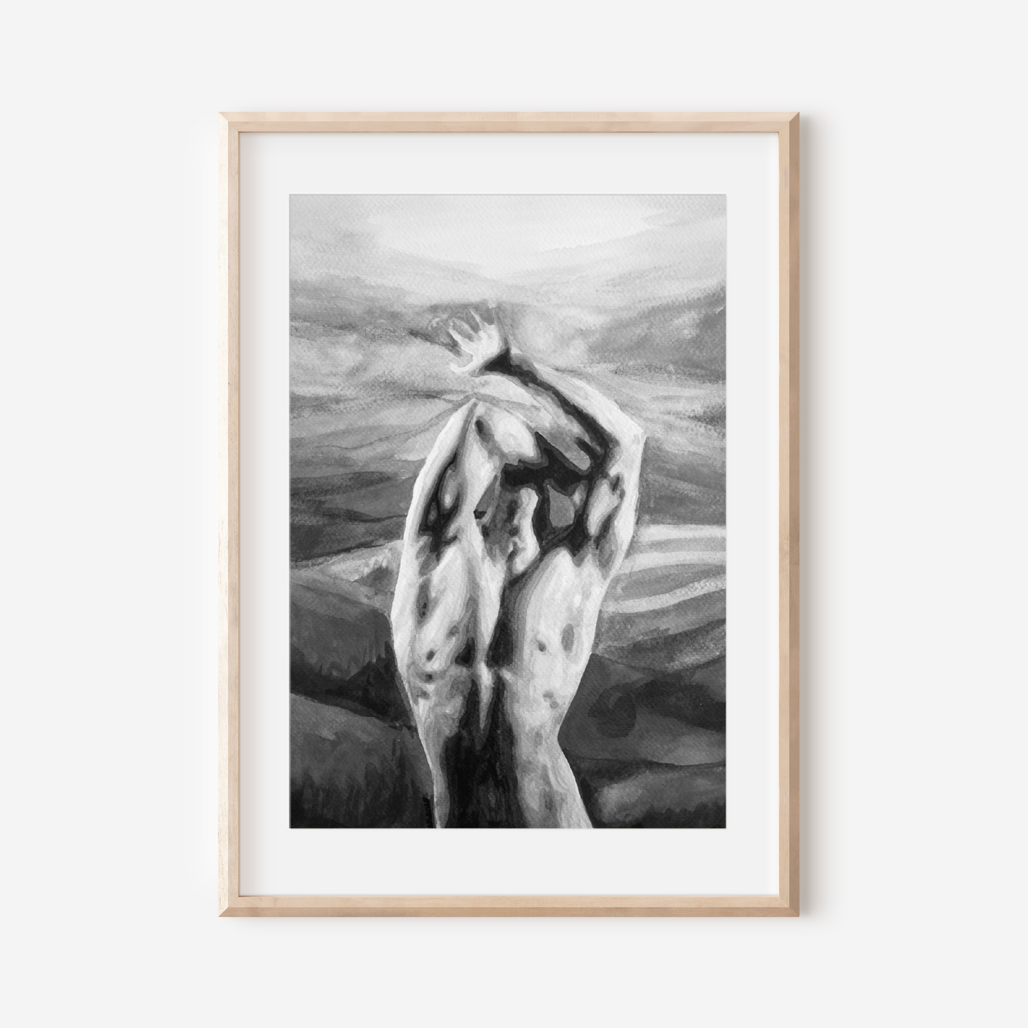 Framed black and white artwork of a nude figure against a mountainous background.