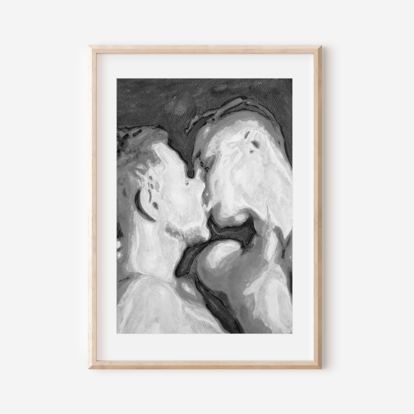 Framed black and white artwork of a couple embracing on a white background