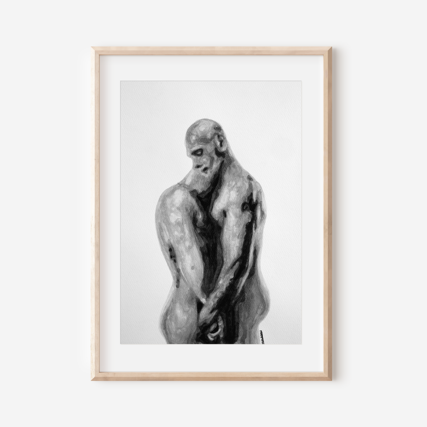 Framed black and white artwork of a muscular figure on a white wall