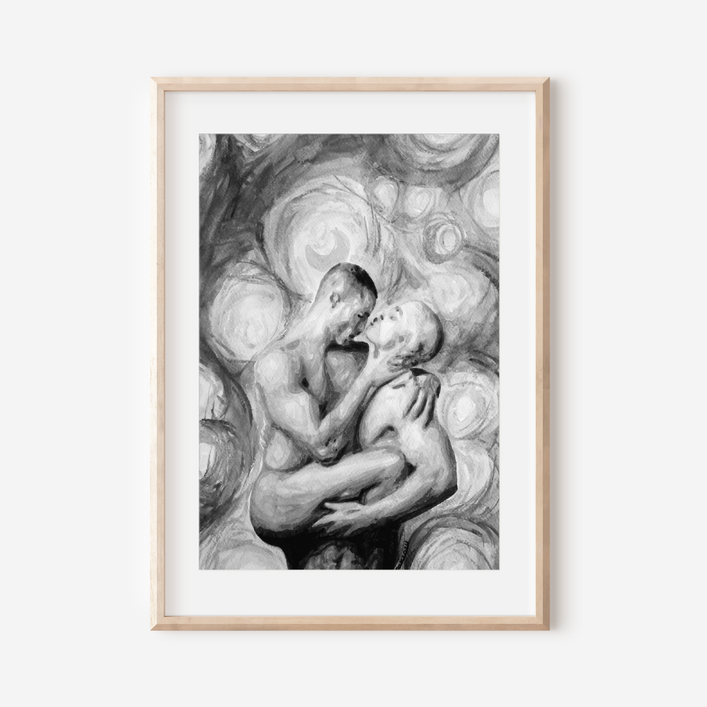 Framed black and white artwork of two people embracing on a white background