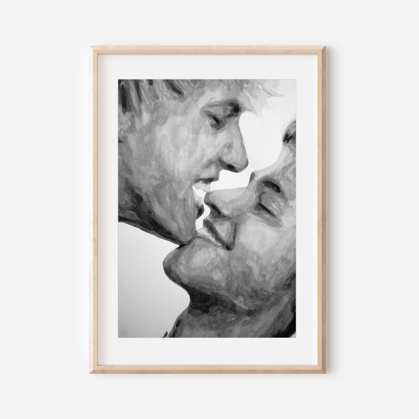 Framed black and white artwork of two faces close together on a white background