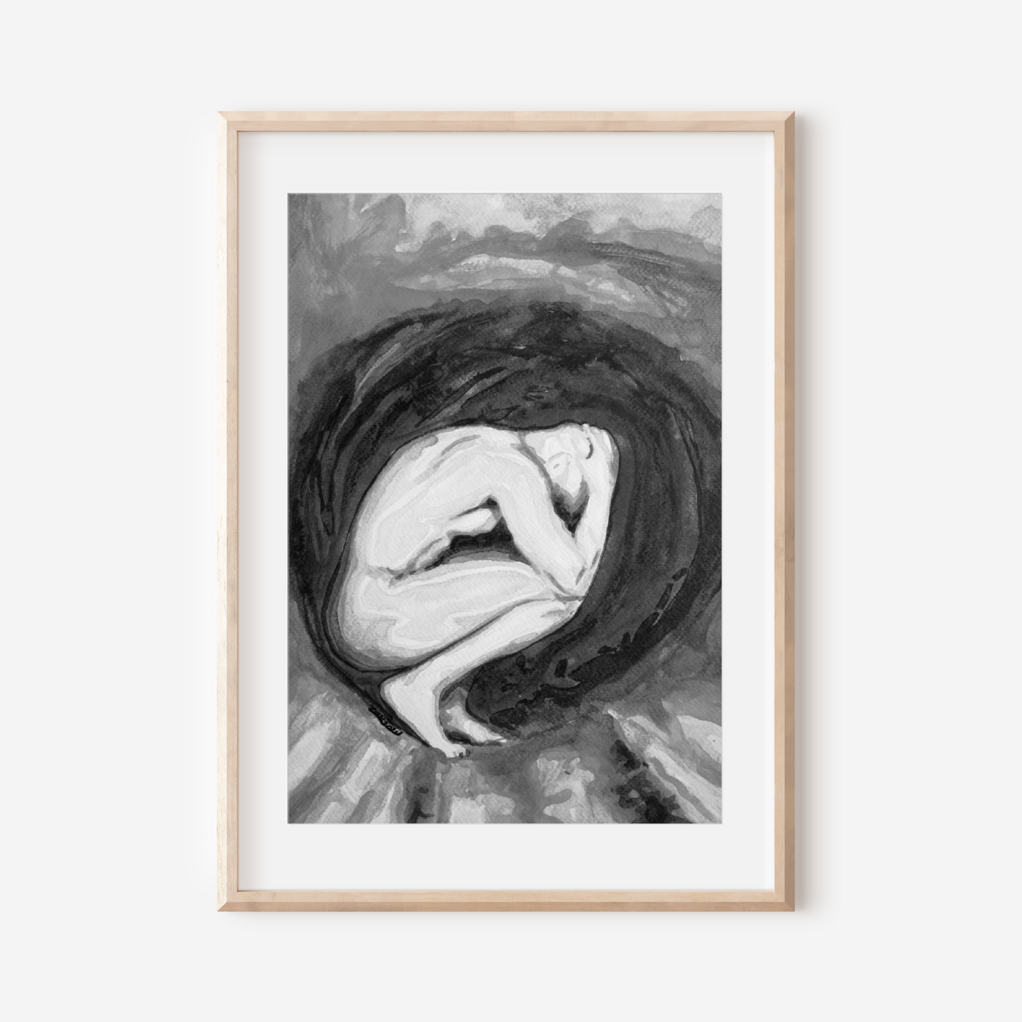 Framed black and white artwork of a woman with her head in her hands on a white background
