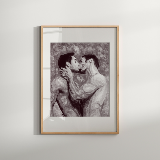Framed artwork of two people embracing on a white wall