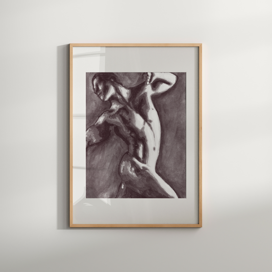 Framed artwork of a nude figure on a white wall