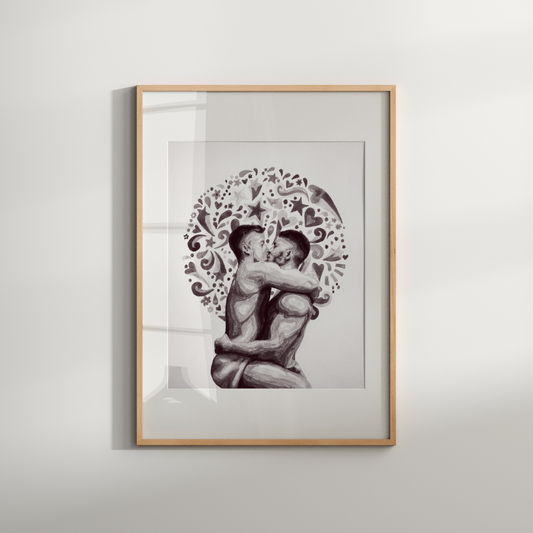 Framed artwork of a couple embracing with decorative elements on a white wall.