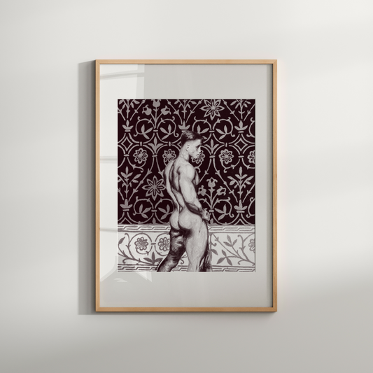 Framed artwork of a classical statue against a decorative patterned wall on a light gray background
