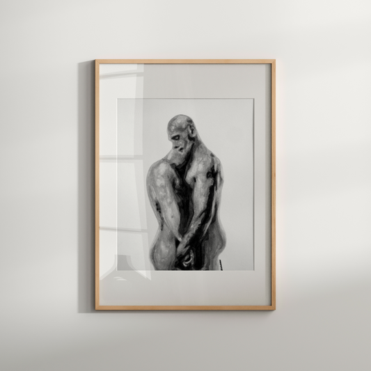 Framed artwork of a sculpture on a white wall