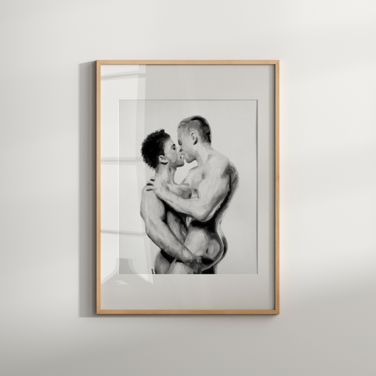 Framed black and white artwork of two people embracing on a light gray background