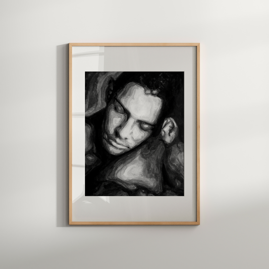Framed black and white portrait on a light gray wall