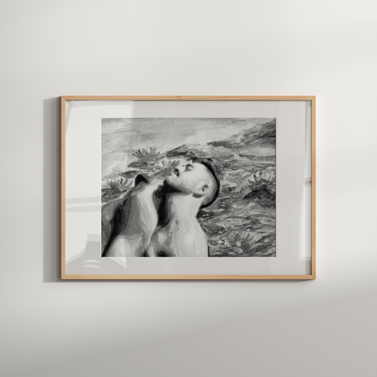 Framed black and white artwork of a woman on a plain wall