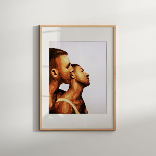 Framed artwork of two profiles on a white wall