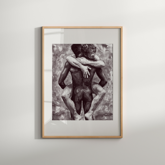 Framed black and white artwork of two nude figures embracing on a light gray background