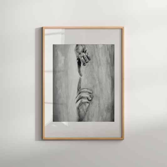 Framed black and white artwork on a light gray wall