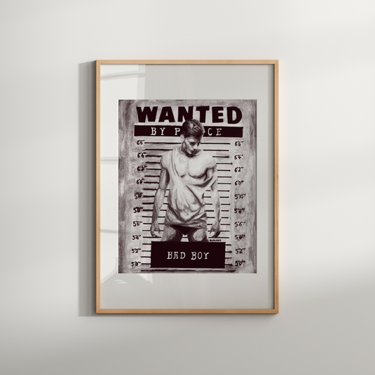 Framed 'Wanted' poster with a person on a white wall