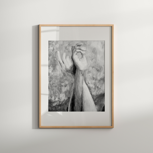 Framed black and white artwork on a plain wall