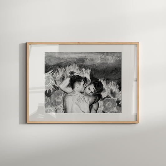 Framed black and white artwork of two people embracing on a light gray wall.