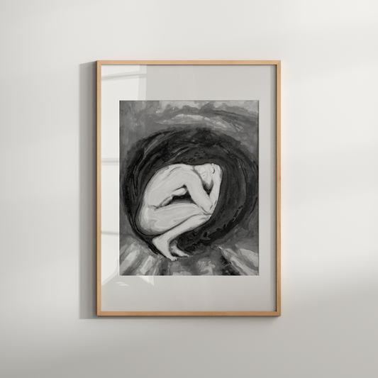Framed black and white artwork of a woman with flowing hair on a light gray wall.