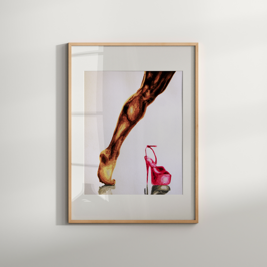 Framed artwork of a leg and pink high heel on a white wall
