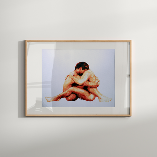 Framed artwork of a nude figure on a white wall