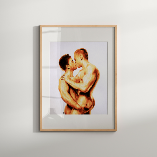 Framed artwork of two people embracing on a white wall