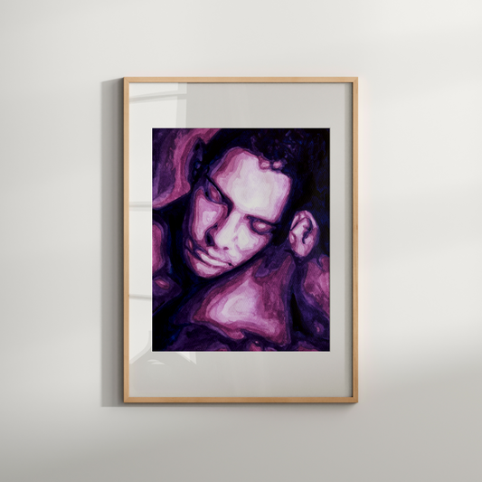 Framed artwork of a stylized portrait with purple and pink hues on a white wall.
