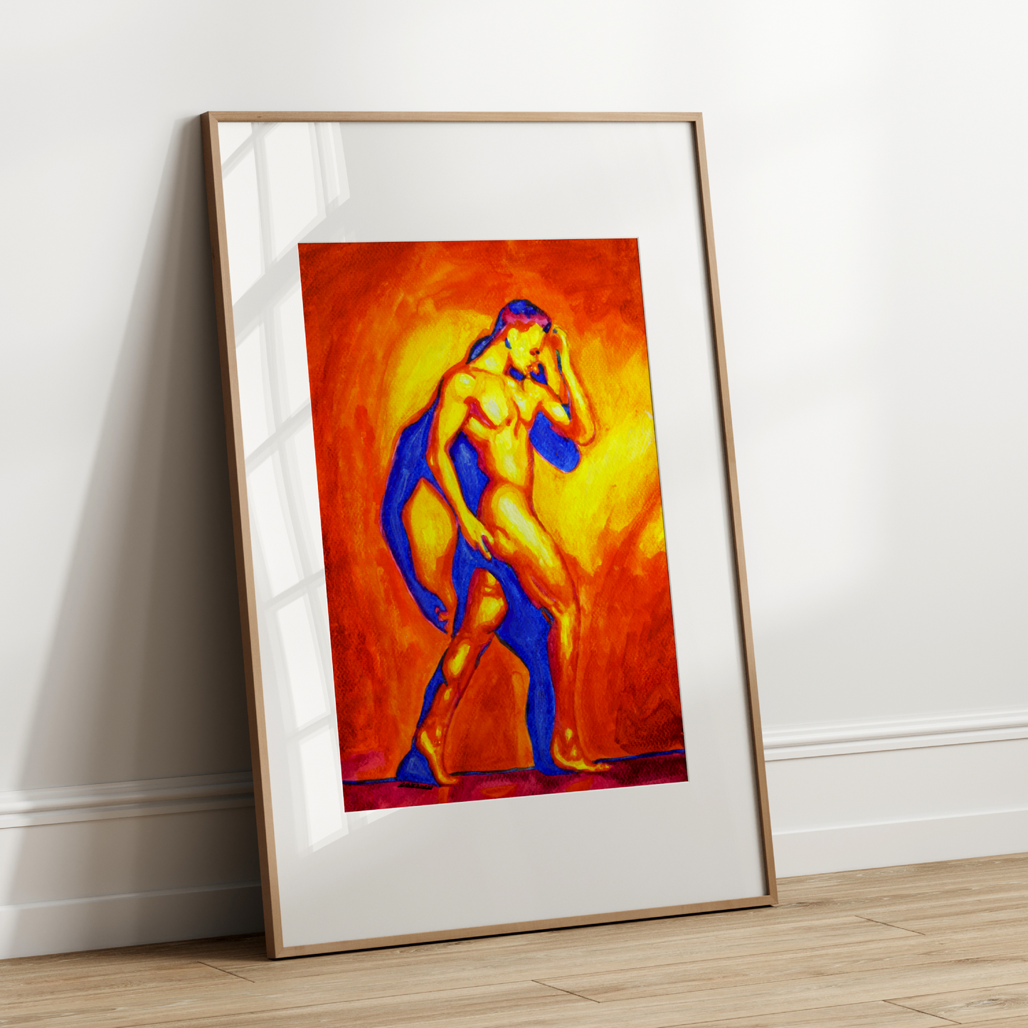 Framed abstract artwork of a nude figure on a white wall.