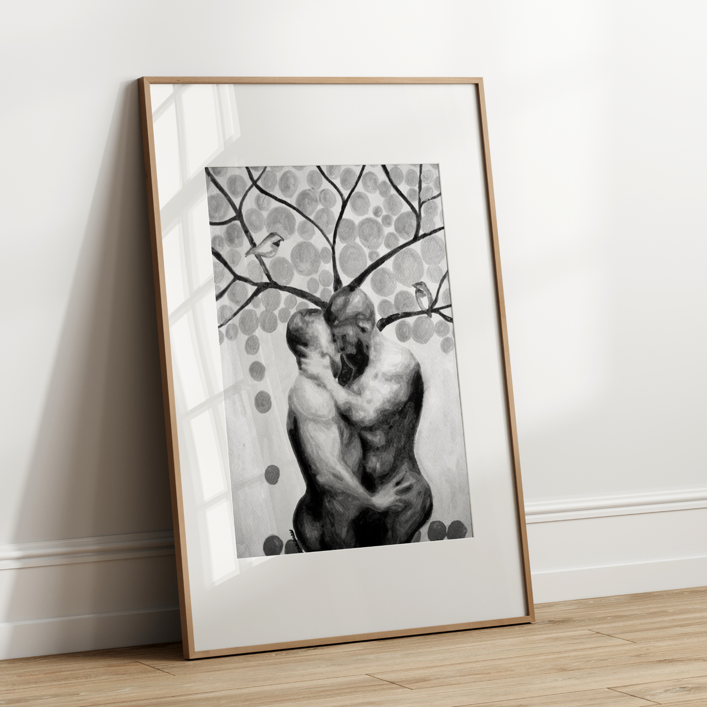 Black and white watercolor painting of two nude men embracing under a tree, with birds and surrounding leaves, expressing queer love, tenderness, and connection. Original Zak Pop Art.