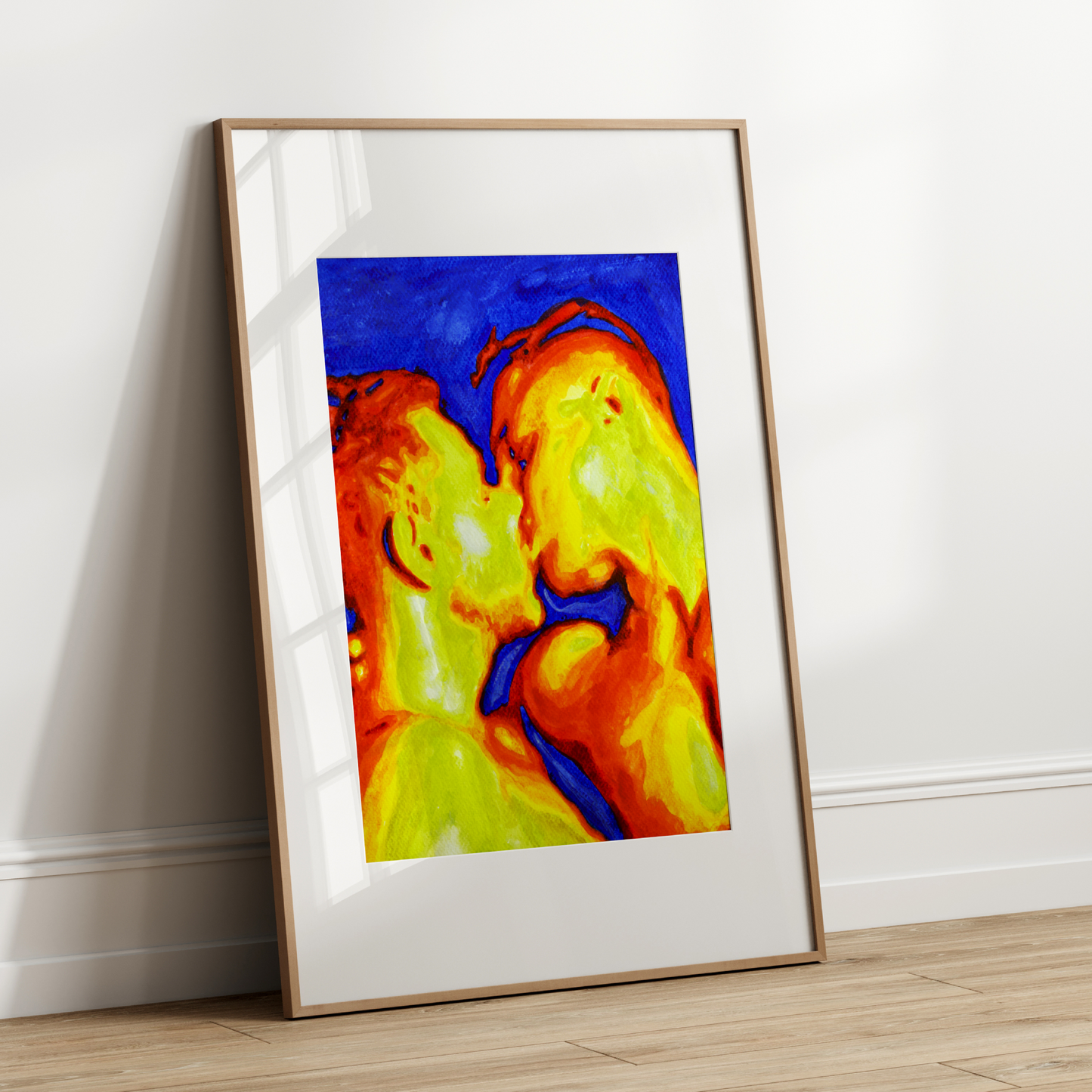 Framed abstract art piece on a white wall