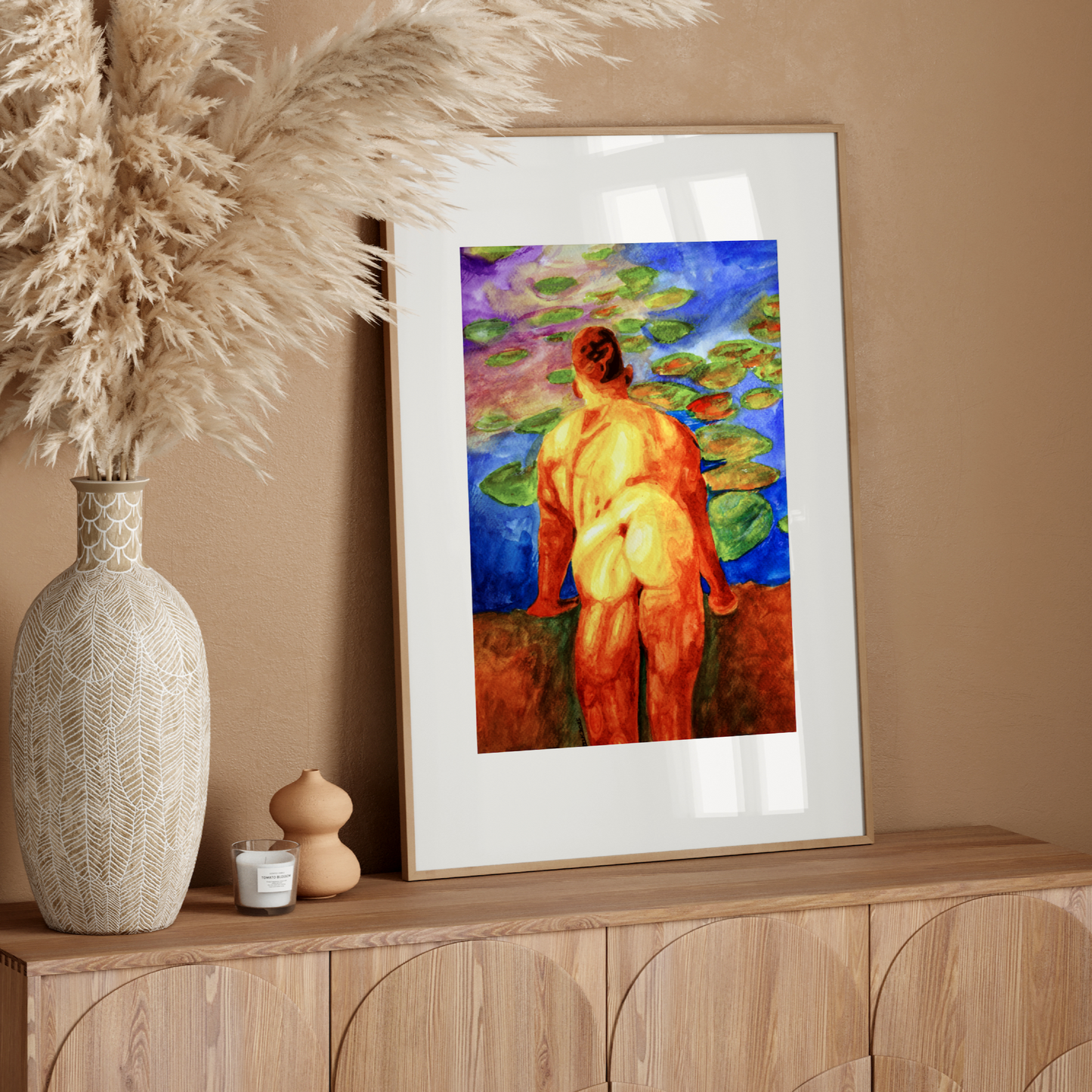 Framed artwork of a nude figure on a wooden console table with decorative elements.