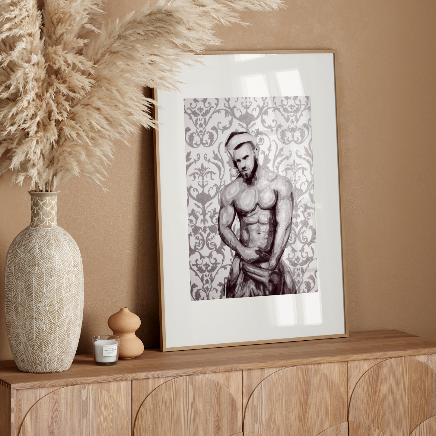 Framed artwork of a shirtless man on a wooden sideboard with decorative elements.