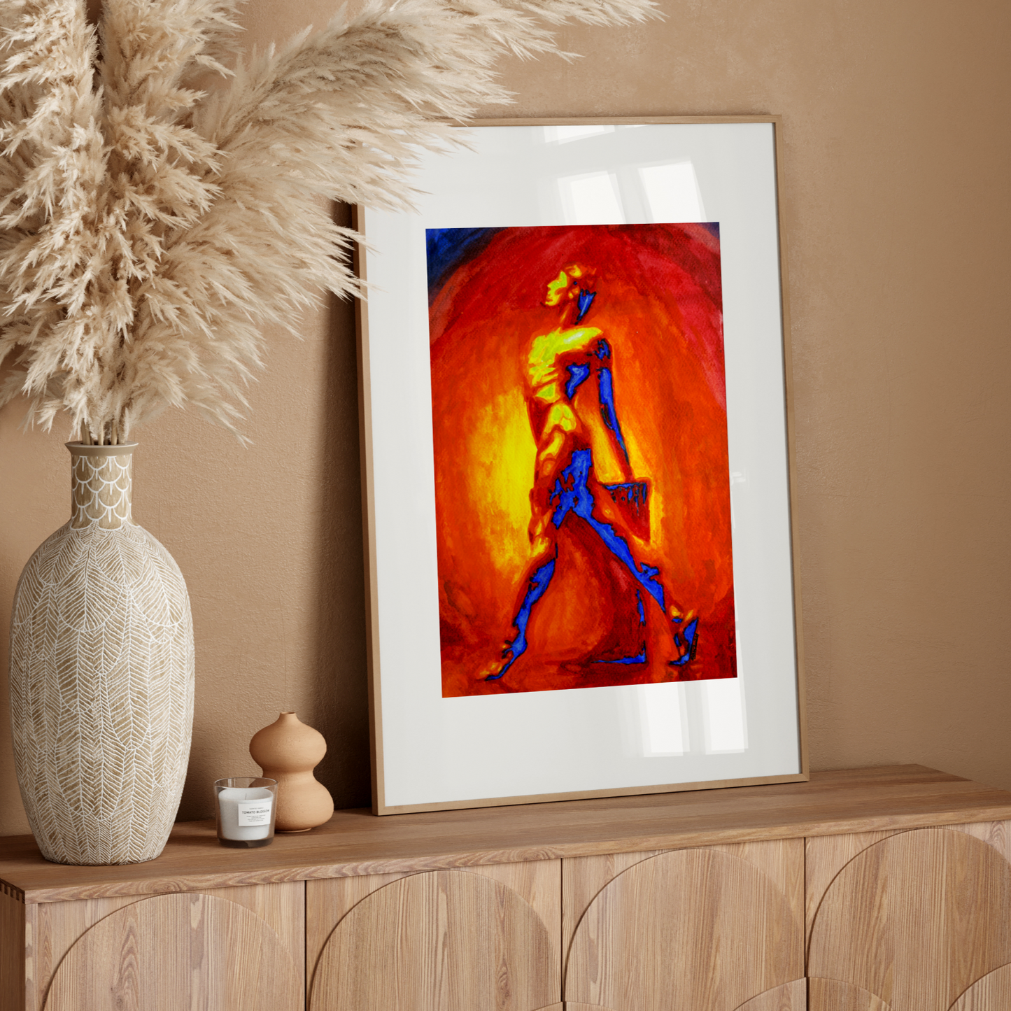Framed abstract artwork on a wooden console table with decorative elements.