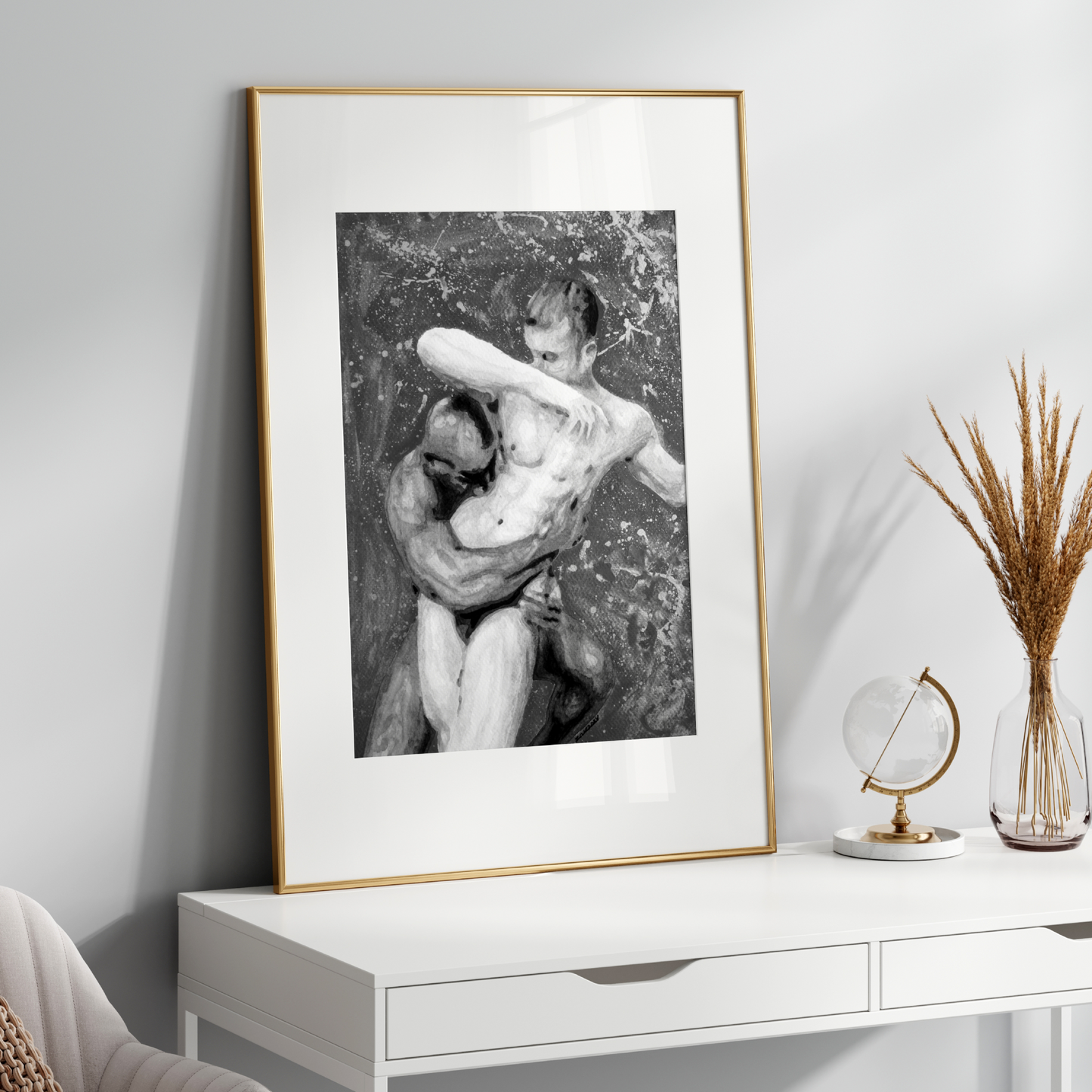 Framed black and white artwork on a white wall above a white console table.