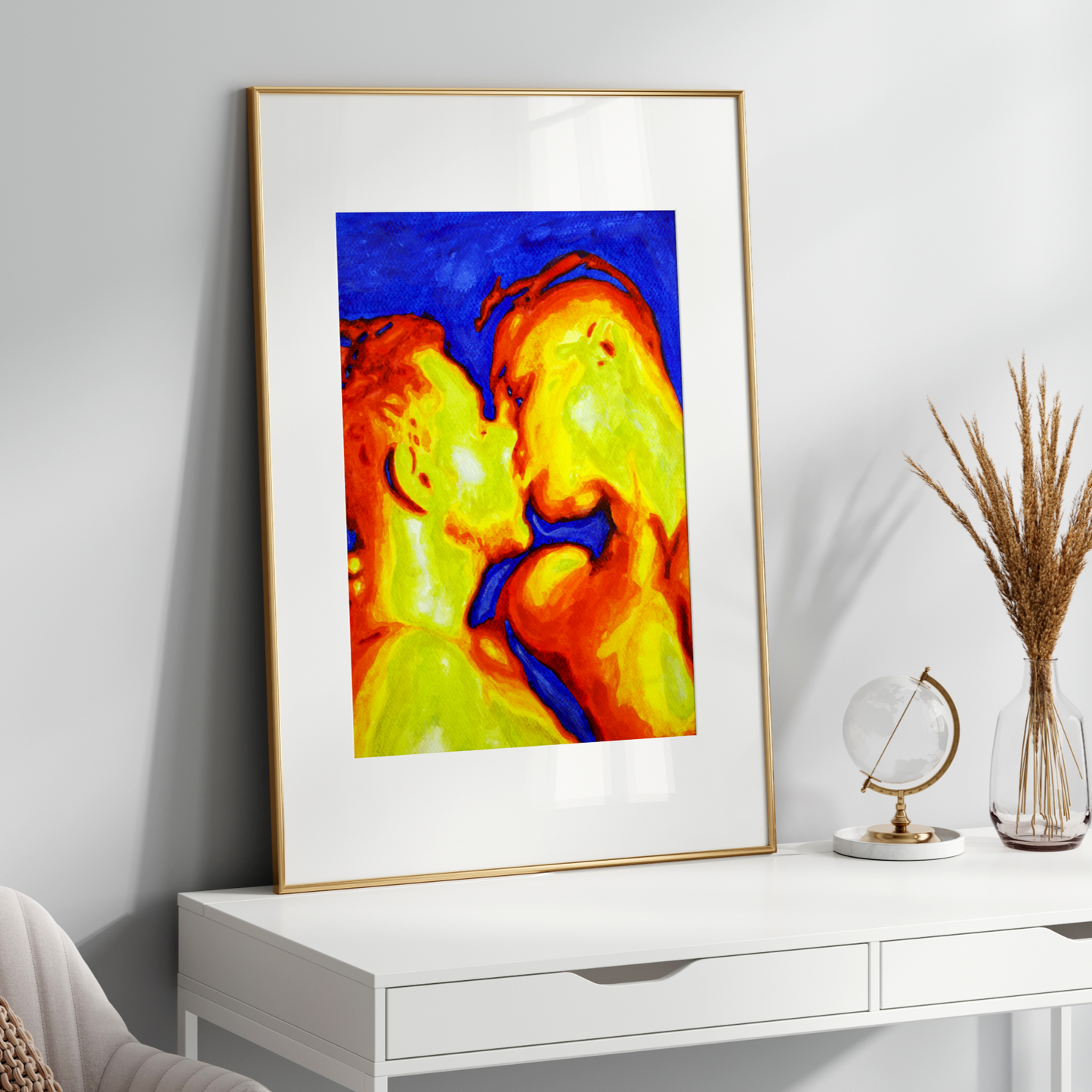 Colorful abstract art in a gold frame on a white wall above a white console table.