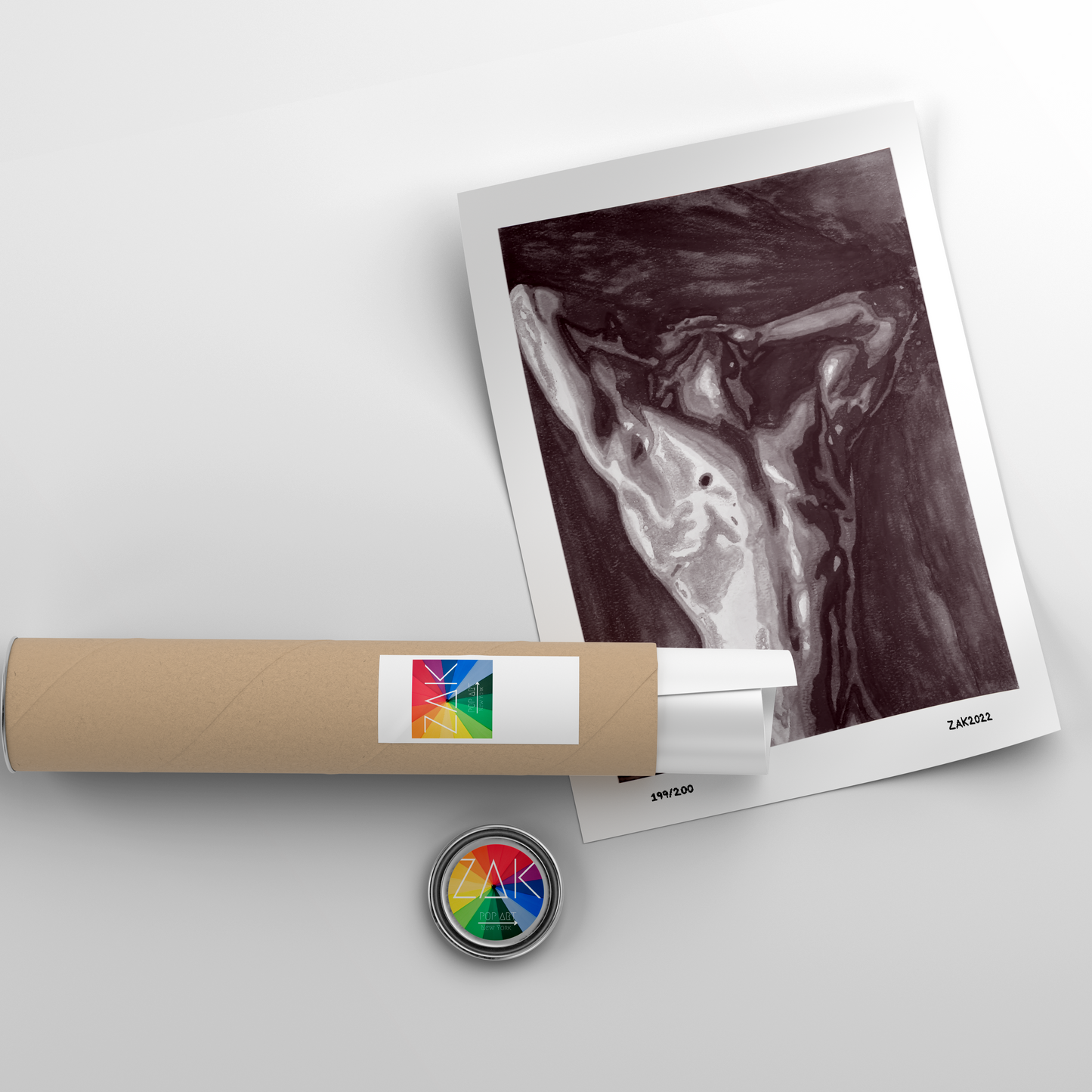 A black and white print of a nude male figure in a contorted pose, framed in a light wood frame.
