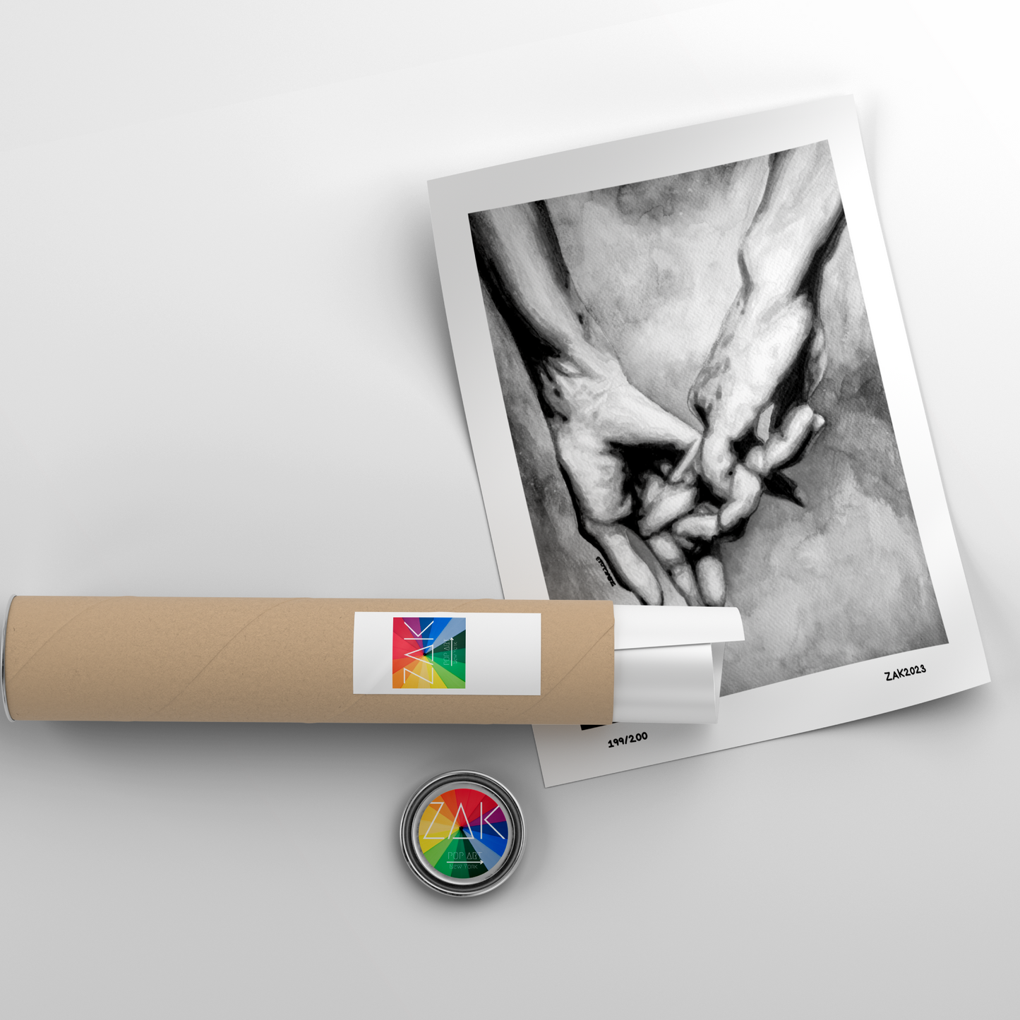 A black and white art print featuring the hands of a same-sex couple, displayed in a simple frame.