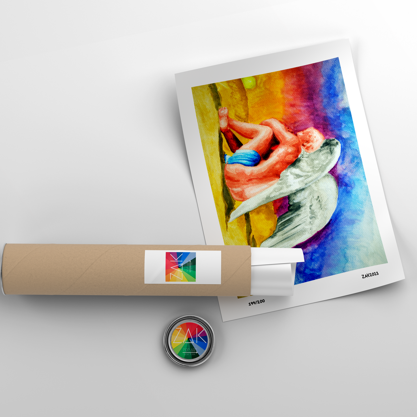 A watercolor painting of an angel sitting next to a sunset, framed in a light wood frame.