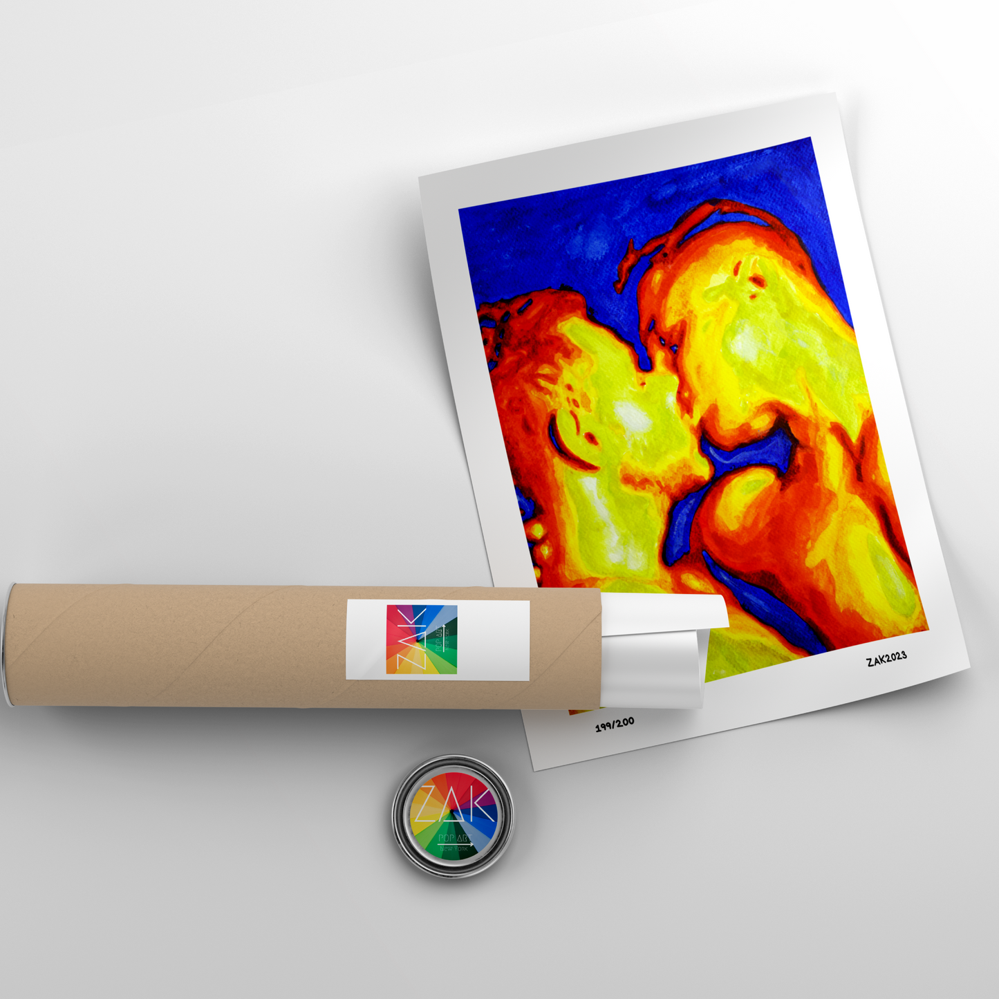 Colorful thermal imaging print with a roll of paper and a small round object on a light gray background