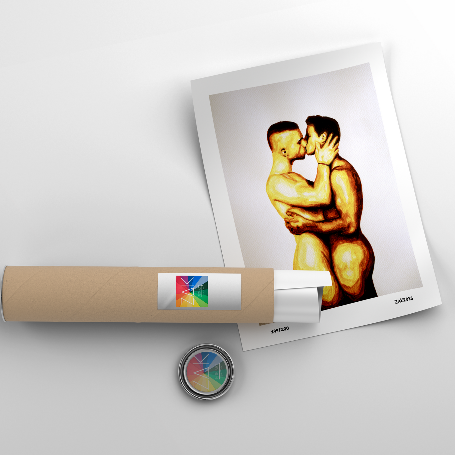 The image depicts a framed art print featuring two nude men in an intimate embrace, expressing a romantic and passionate kiss. The artwork is rendered in a soft, warm color palette, emphasizing the sensuality and emotion of the scene.