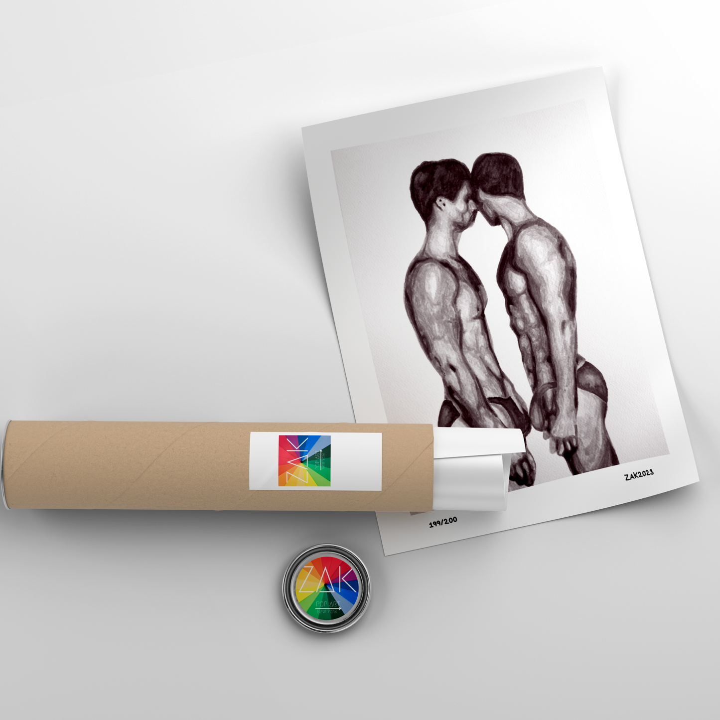 A black and white print of a nude male couple, framed in a light wood frame.