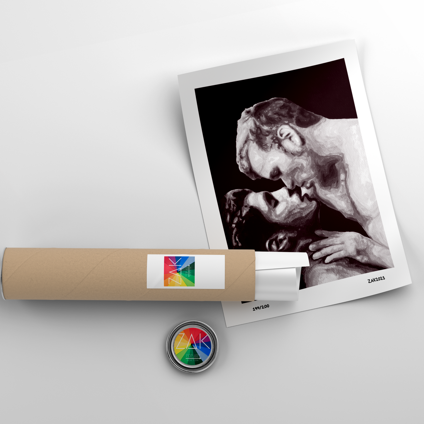 A black and white art print of a same-sex couple kissing, framed in a light wood frame.