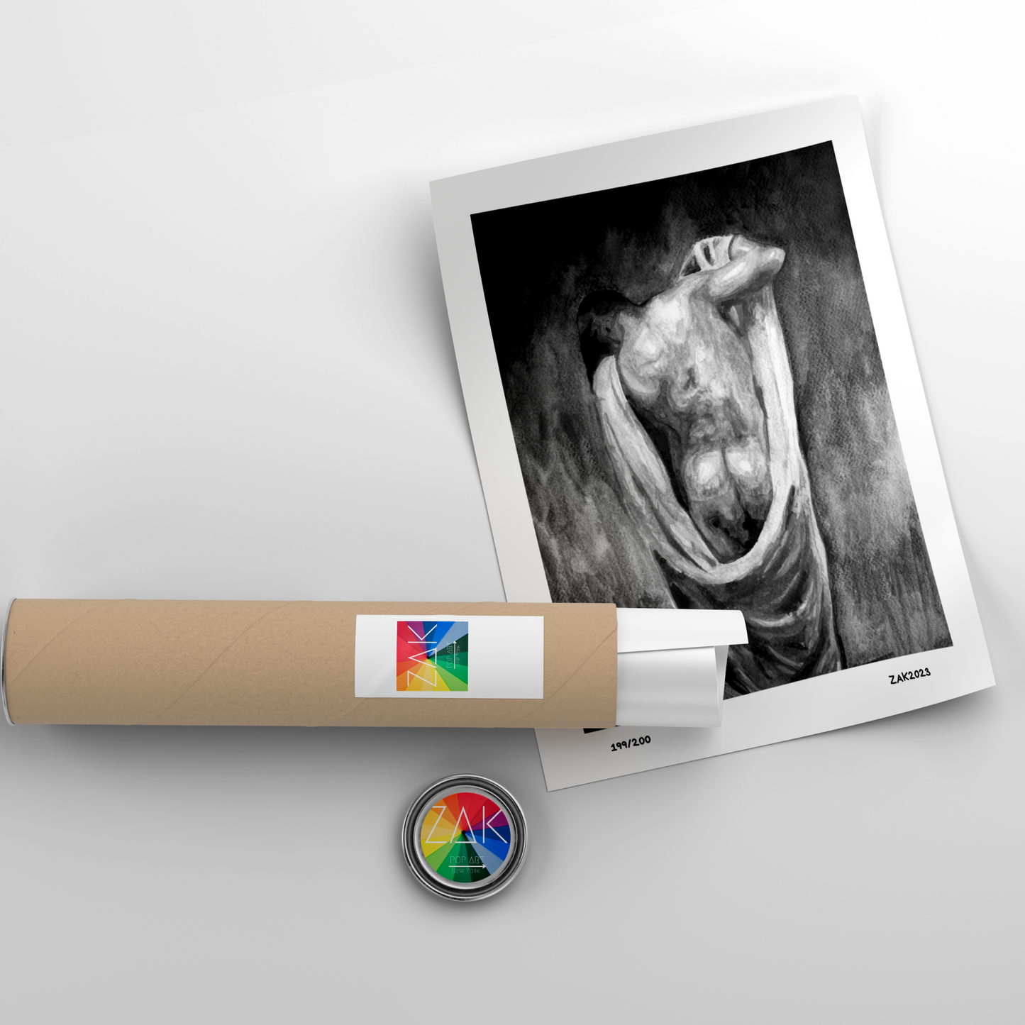 Rolled-up photo paper with a printed black and white image of a sculpture on a light gray background.
