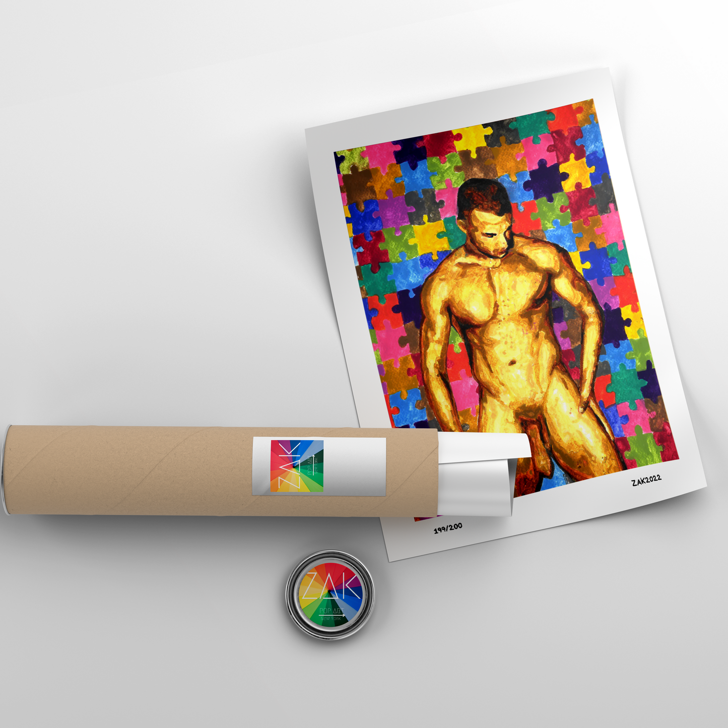 This image displays a striking art piece titled "Jigsaw Model 2," featuring a vibrant and colorful depiction of a male figure in a jigsaw puzzle pattern. The artwork combines erotic and unique design elements, portraying a shirtless male figure against a background of colorful, puzzle-piece-like shapes.