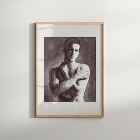 A black and white art print of a nude male figure with crossed hands, framed in a simple wood frame.