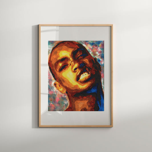 A framed artwork featuring an abstract portrait of a male figure with vibrant colors, signed and numbered by the artist.