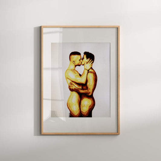The image depicts a framed art print featuring two nude men in an intimate embrace, expressing a romantic and passionate kiss. The artwork is rendered in a soft, warm color palette, emphasizing the sensuality and emotion of the scene.