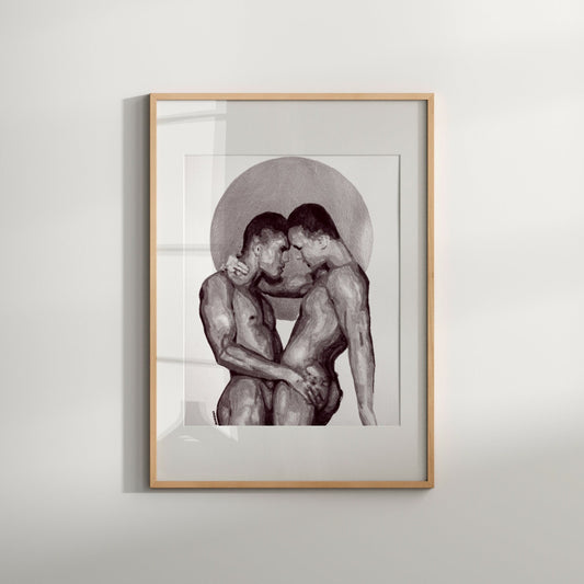 A black and white print of an erotic gay couple, displayed in a frame.