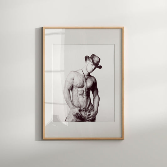 This image features a striking black and white print titled "Cowboy," which epitomizes the bold and erotic artistry of an LGBTQ artist. The print captures a powerful and poignant depiction of a male nude figure, exuding raw masculinity and queer sensuality.