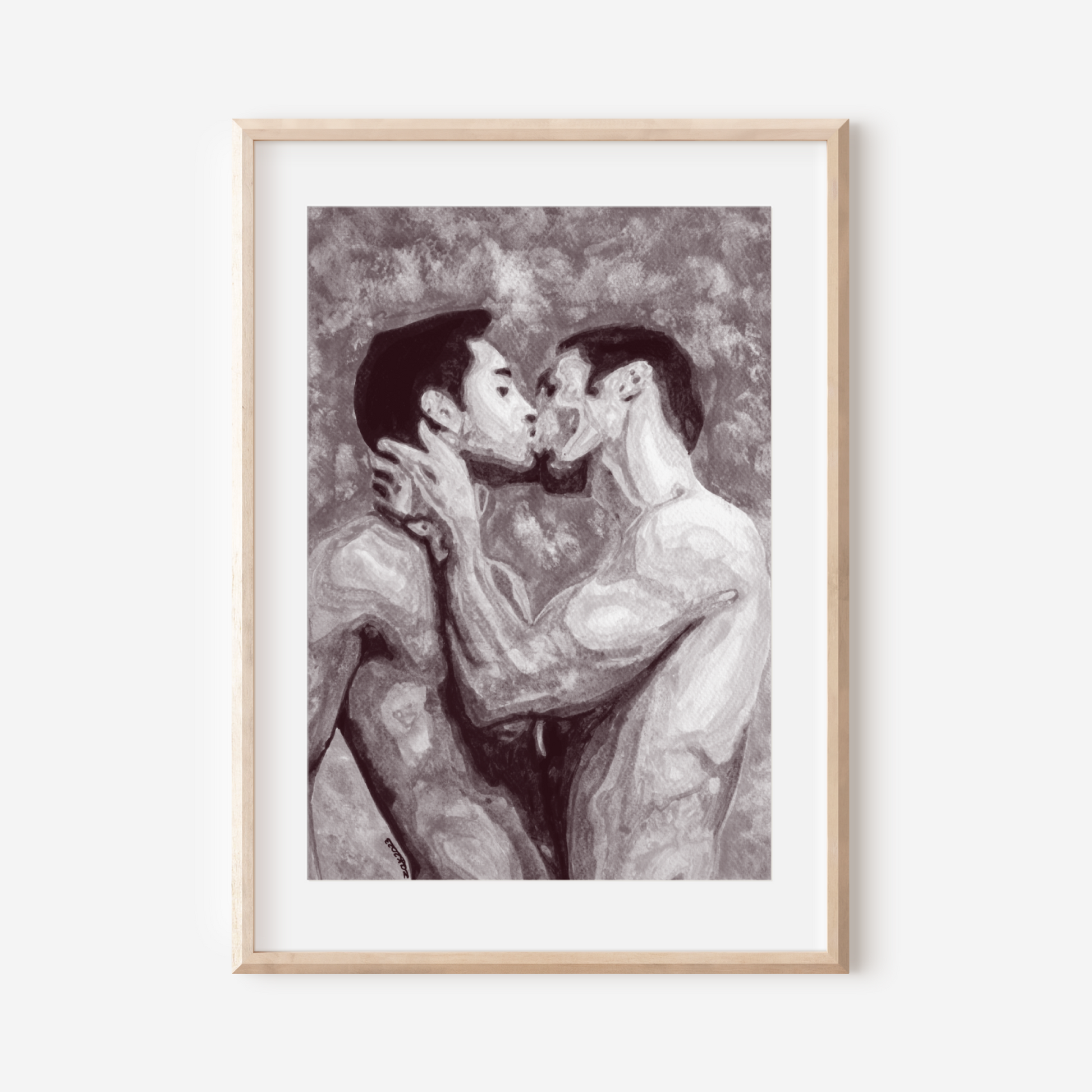 Framed artwork of two people kissing on a white wall