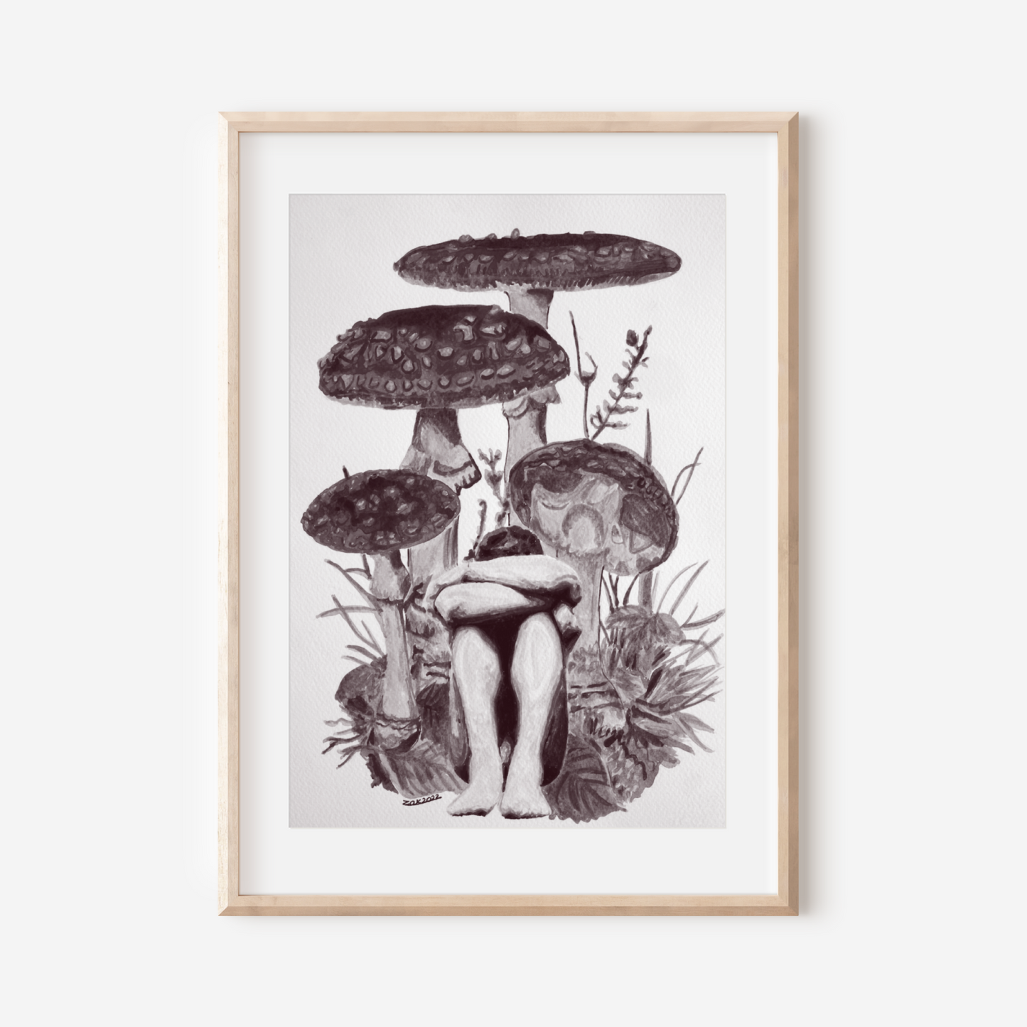 Framed artwork of mushrooms on a white wall