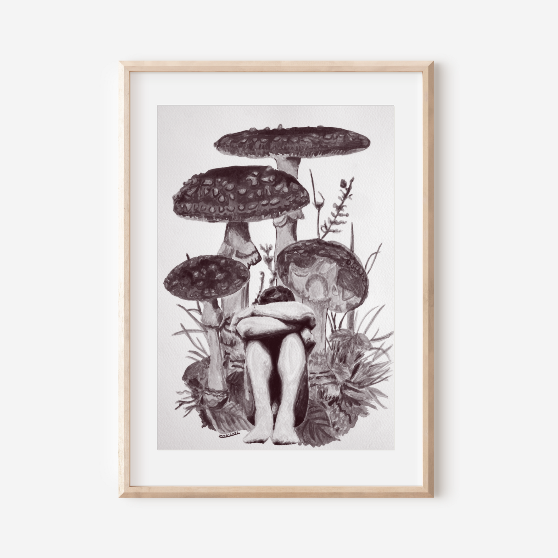 Framed artwork of mushrooms on a white wall